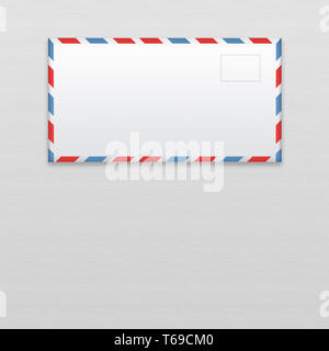 Post envelope on gray wooden background. Stock Photo