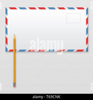 Post envelope and yellow pencil on gray wooden background. Stock Photo