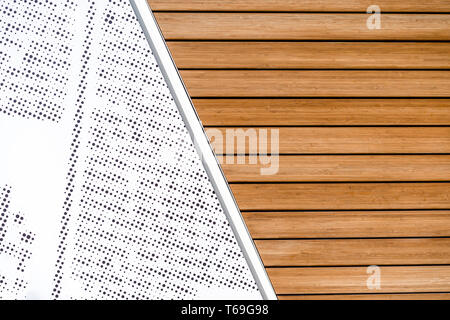 Modern two-part background connected with diagonally natural wooden lacquered slats and a pattern with grouped check points on a white background Stock Photo