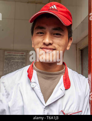 Beijing, China. 18th Oct, 2006. A male food vendor in Donghuamen Night Market in Beijing. Credit: Arnold Drapkin/ZUMA Wire/Alamy Live News