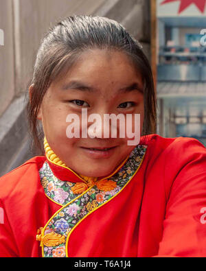 Beijing, China. 18th Oct, 2006. A young female waitress in Donghuamen Night Market in Beijing. Credit: Arnold Drapkin/ZUMA Wire/Alamy Live News