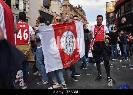 Leicester Square, London, UK. 30th April 2019. Ajax football fans meet in Leicester Square before the Champions League match against Tottenham. Credit: Matthew Chattle/Alamy Live News Stock Photo
