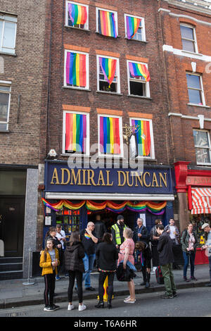 London, UK. 30th April 2019. Members of the LGBTQ community begin to gather to join survivors of the Admiral Duncan bombing and families and friends of the victims outside the Admiral Duncan pub in Old Compton Street, Soho, to mark 20 years since the attack. Three people were killed and 79 injured when a bomb packed with up to 1,500 four-inch nails was detonated by a neo-Nazi at the Admiral Duncan on 30th April 1999. Credit: Mark Kerrison/Alamy Live News Stock Photo