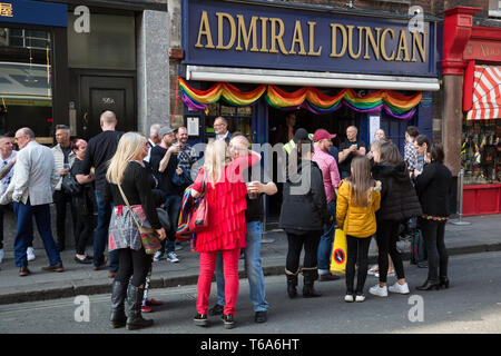 London, UK. 30th April 2019. Members of the LGBTQ community begin to gather to join survivors of the Admiral Duncan bombing and families and friends of the victims outside the Admiral Duncan pub in Old Compton Street, Soho, to mark 20 years since the attack. Three people were killed and 79 injured when a bomb packed with up to 1,500 four-inch nails was detonated by a neo-Nazi at the Admiral Duncan on 30th April 1999. Credit: Mark Kerrison/Alamy Live News Stock Photo