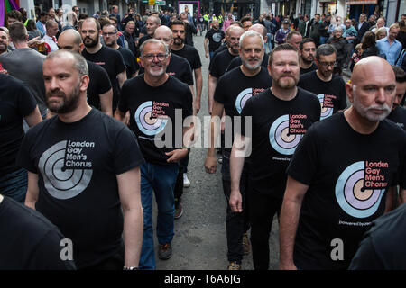 London, UK. 30th April 2019. London Gay Men’s Chorus joins survivors of the Admiral Duncan bombing, families and friends of the victims and the LGBTQ community outside the Admiral Duncan pub in Old Compton Street, Soho, to mark 20 years since the attack. Three people were killed and 79 injured when a bomb packed with up to 1,500 four-inch nails was detonated by a neo-Nazi at the Admiral Duncan on 30th April 1999. Credit: Mark Kerrison/Alamy Live News Stock Photo