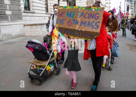London, UK. 30th April 2018. Families from Extinction Rebellion walked from Parliament Square to protest on the steps of the Treasury, calling for an end to all subsidies for carbon-based fuels which are polluting our air and causing many premature deaths as well as respiratory illnesses that choke our children. Children are particularly vulnerable and many London streets and schools have illegal levels of air pollution. They say we need to end the addiction to these fuels for transport and home heating. Peter Marshall/Alamy Live News