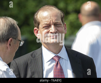 Washington, District of Columbia, USA. 30th Apr, 2019. United States Secretary of Labor Alex Acosta converses with an unidentified person as he awaits the arrival of US President Donald J. Trump who will welcome the 2018 NASCAR Cup champion Joey Logano to the South Lawn of the White House in Washington, DC on April 30, 2019. Credit: Ron Sachs/CNP Credit: Ron Sachs/CNP/ZUMA Wire/Alamy Live News Stock Photo