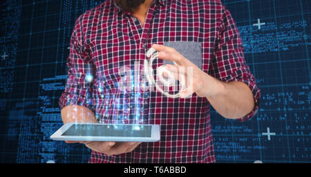 Composite image of mid section of man gesturing while holding digital tablet Stock Photo
