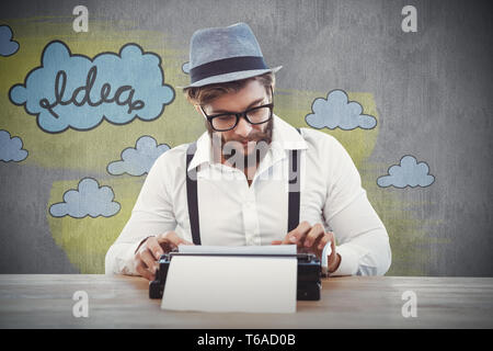 Composite image of hipster wearing eye glasses and hat working on typewriter Stock Photo