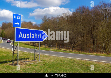 German road sign: signpost at junction (all directions Stock Photo - Alamy