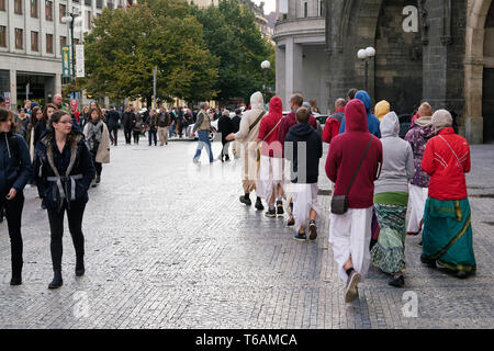 Hare Krishna singings march through the street Stock Photo - Alamy