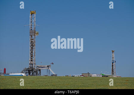 Midland County, Texas  USA - 21 April 2019 : Drilling rigs in the Permian Basin oilfield. Stock Photo