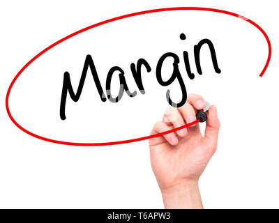 Man Hand writing Margin with black marker on visual screen Stock Photo