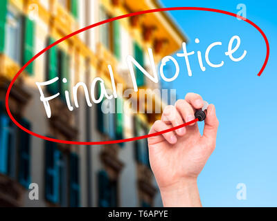 Man Hand writing Final Notice with black marker on visual screen Stock Photo