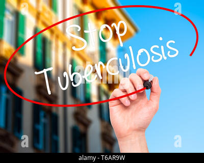 Man Hand writing Stop Tuberculosis with black marker on visual screen. Stock Photo