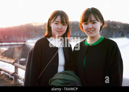 Two sisters posing for a snapshot in Winter Stock Photo