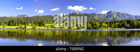 wide panorama landscapes in Bavaria with alps mountains and lake Stock Photo