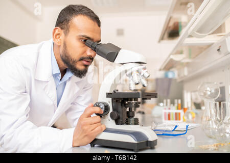 Researcher working with microscope Stock Photo