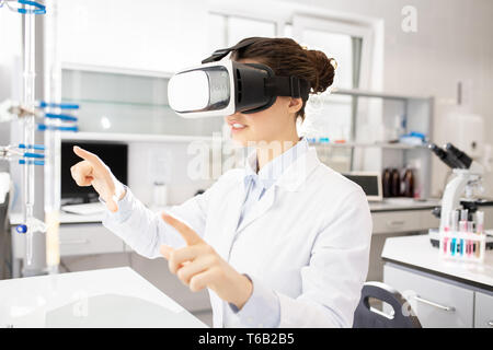 Scientific researcher using virtual reality simulator Stock Photo