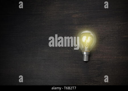 great idea concept with light bulb on wooden table Stock Photo
