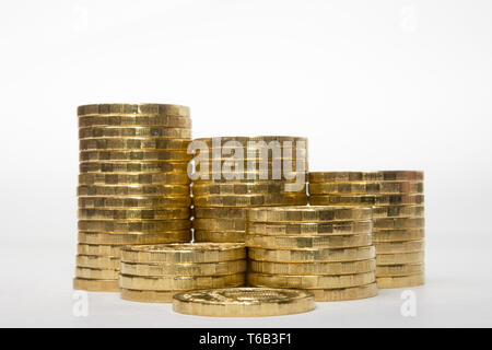 Stacks of coins increasing in height uniformly Stock Photo