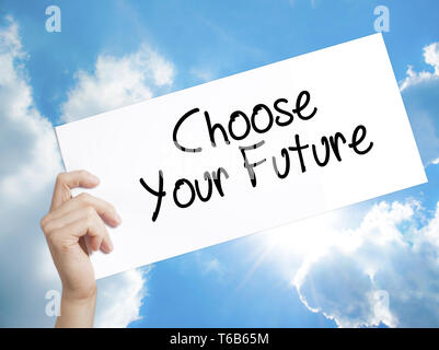 Choose your Future Sign on white paper. Man Hand Holding Paper with text. Isolated on sky background Stock Photo