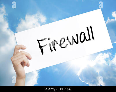 Firewall  Sign on white paper. Man Hand Holding Paper with text. Isolated on sky background Stock Photo