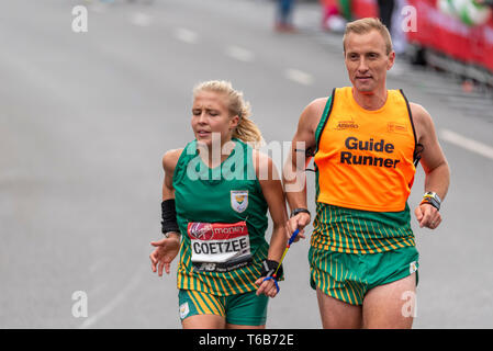 Louzanne Coetzee racing in the Virgin Money London Marathon 2019 near Tower Bridge, London, UK Stock Photo