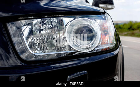 Close up detail on one of headlights modern car Stock Photo