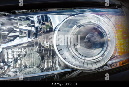 Close up detail on one of headlights modern car Stock Photo