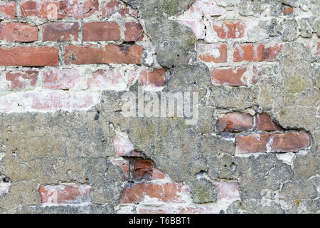 old brick wall, partially plastered for backgrounds Stock Photo