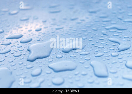 Raindrops on a metallic surface Stock Photo