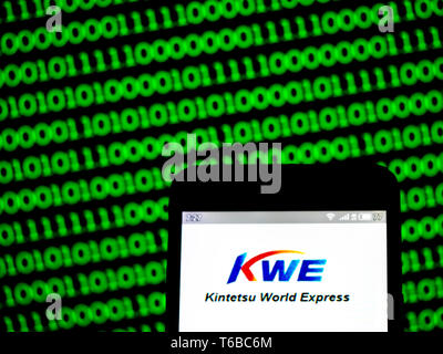 In this photo illustration a Kintetsu World Express, Inc. (KWE) logo ...