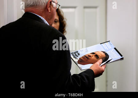 The President of the United States, Barack Obama, signs into law improved rights for veterans. Stock Photo