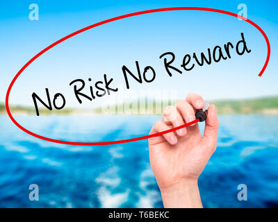 Man Hand writing No Risk No Reward with black marker on visual screen Stock Photo