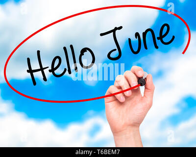 Man Hand writing Hello June  with black marker on visual screen Stock Photo