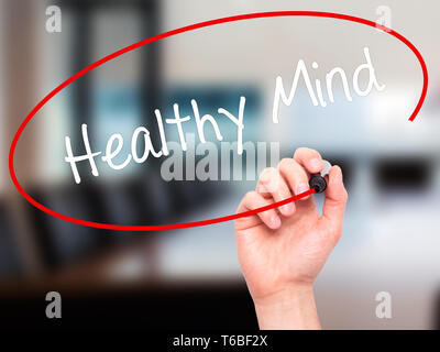 Man Hand writing Healthy Mind with black marker on visual screen ...