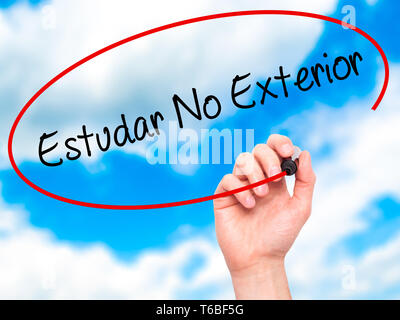 Man Hand writing Estudar No Exterior  (Studying Abroad in Portuguese)  with black marker on visual screen Stock Photo
