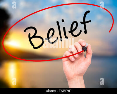 Man Hand writing Belief with black marker on visual screen. Isolated on ...