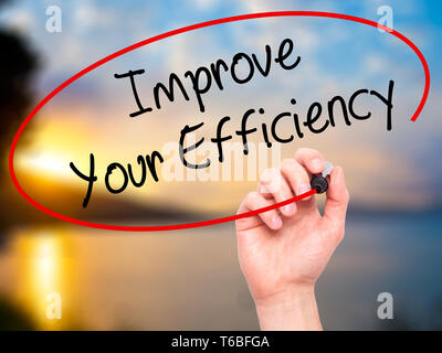 Man Hand writing Improve Your Efficiency with black marker on visual ...