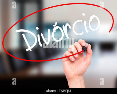 Man Hand writing Divorcio (Divorce in Portuguese) with black marker on visual screen. Stock Photo