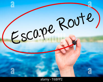 Man Hand writing Escape Route with black marker on visual screen Stock Photo