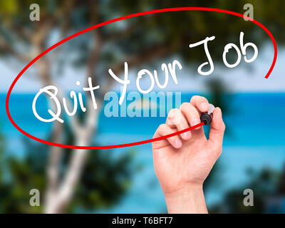 Man Hand writing Quit Your Job with black marker on visual screen. Stock Photo