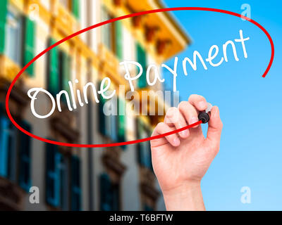 Man Hand writing Online Payment with black marker on visual screen. Stock Photo