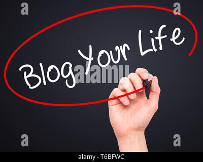 Man Hand writing Blog Your Life with black marker on visual screen Stock Photo