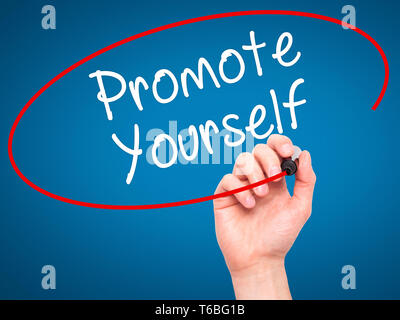 Man Hand writing Promote Yourself with black marker on visual screen Stock Photo