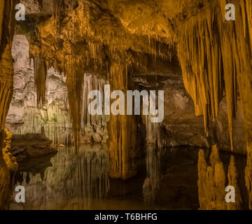 Neptune's Grotto (Grotta di Nettuno) a natural stalactite cave near Alghero , Sardinia, Italy. Accessible when the waters are calm by a steep stairway Stock Photo