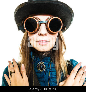 Beauty and fashion - retro style. Portrait of vintage pretty woman in black hat topper and old goggles isolated on white. Stock Photo