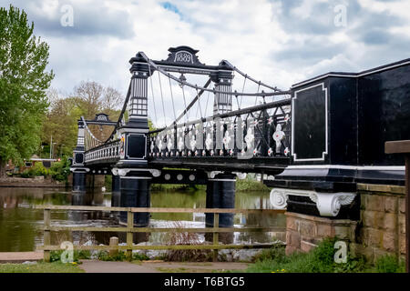 The Ferry Bridge Pedestrian Bridge over the River Trent at Stapenhill Gardens ,Burton upon Trent.Staffordshire.England Stock Photo