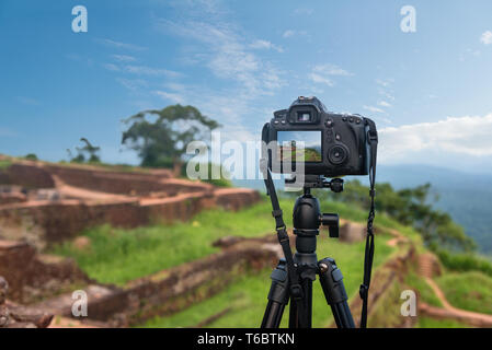 Photo camera mounted on tripod outdoors Stock Photo
